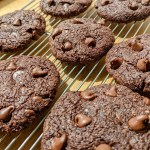 Choclolate cookies cooling on a wire rack.